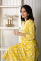 Image for Kusvaa Daf09 Saffron Yellow Screen Printed A Line Kurta Sitting