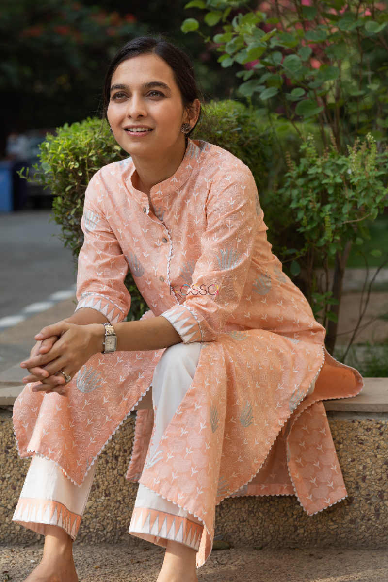 Image for Kusvaa Avdaf Clam Shell Peach And White Kurta Pant Set Sitting