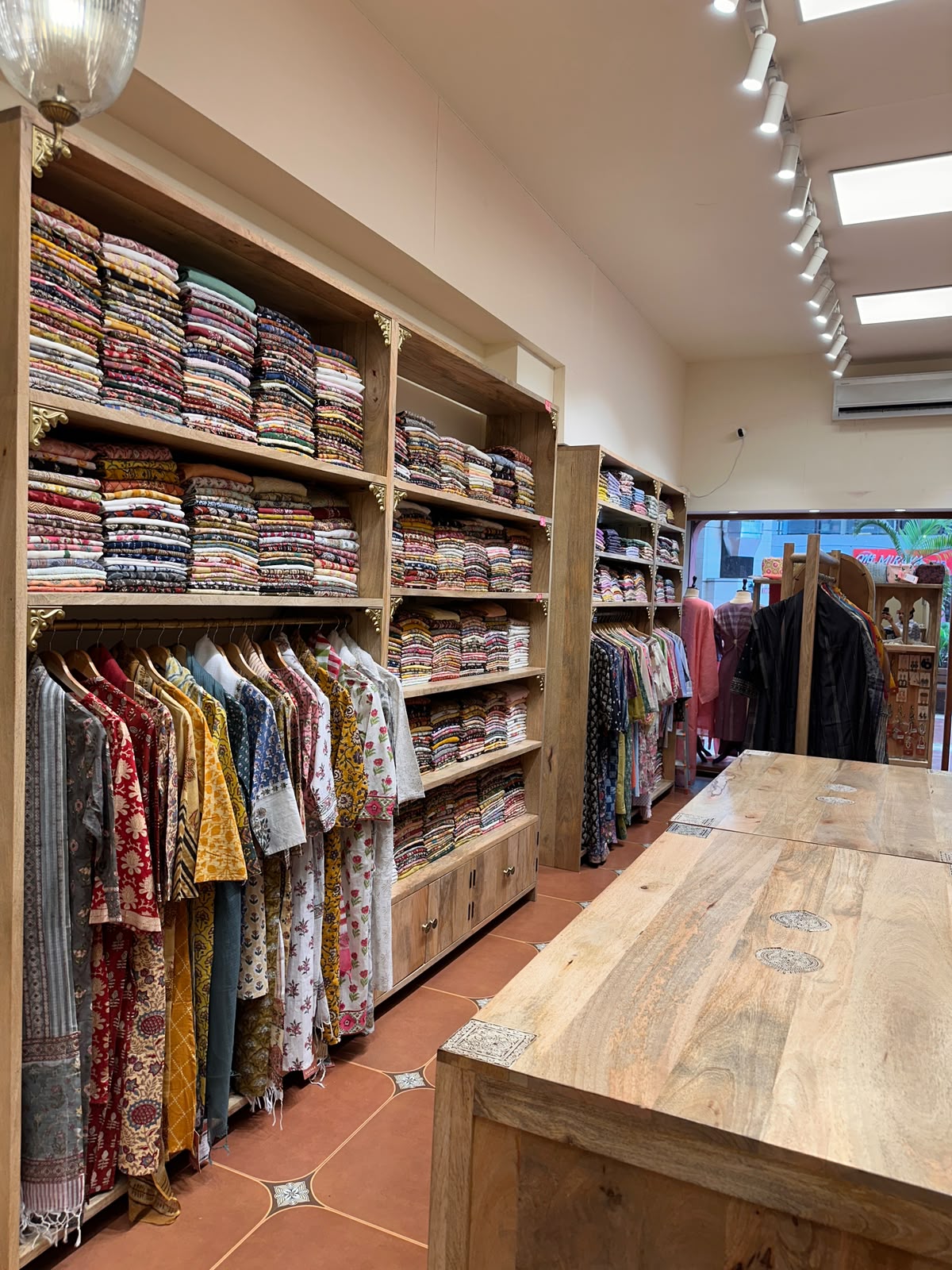 Display Tables Kurta Wall — inside Kusvaa Vastrapur