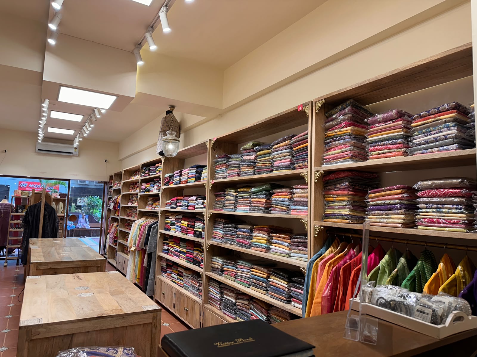 Packaged Suit Sets Wall — inside Kusvaa Vastrapur