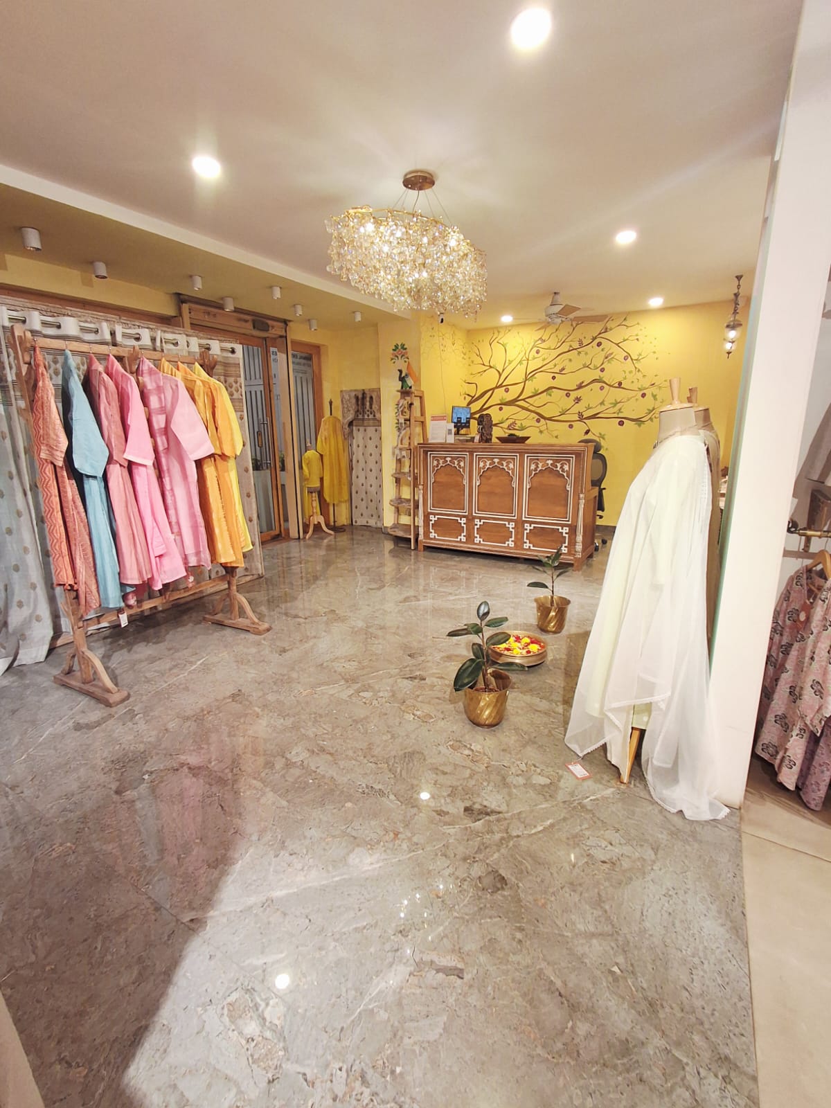 Pastel Kurtas Wooden Stand — inside Kusvaa Indiranagar